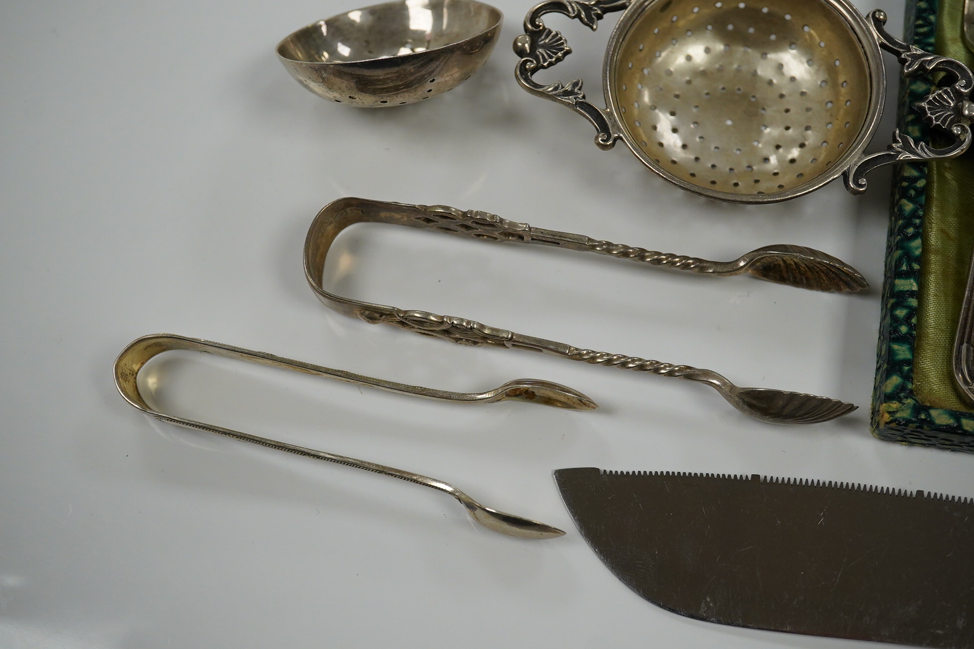 Sundry silver including cake forks, sifter ladle, salt spoons, Victorian silver handled bread knife, etc. Condition - poor to fair